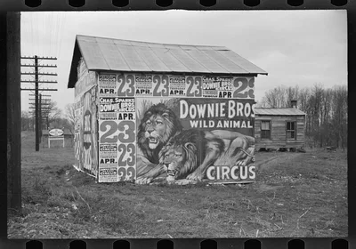 [Posters covering a building near Lynchburg to advertise a Downie…, 1936