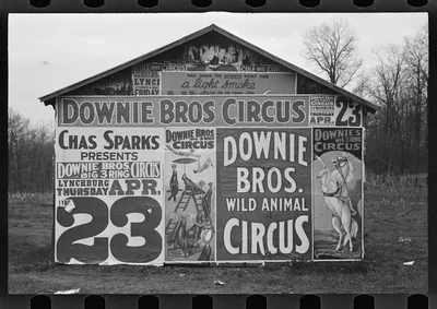 Photograph from 1935: [Posters covering a building near Lynchburg to…
