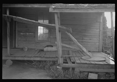 Porch of a sharecropper's cabin, Hale County, Alabama, 1936